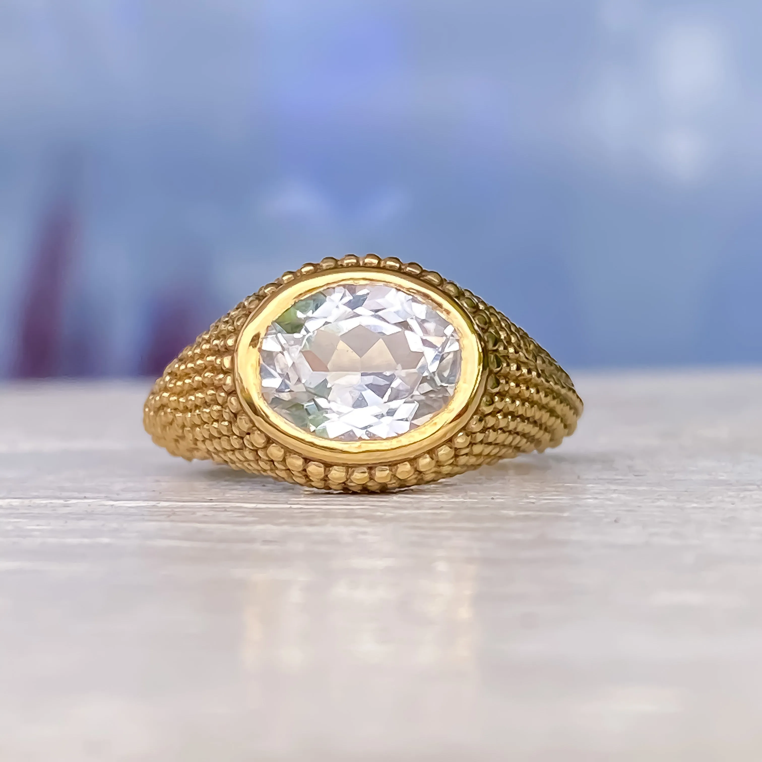 Nubia Oval White Topaz Yellow Gold Ring Size 7US